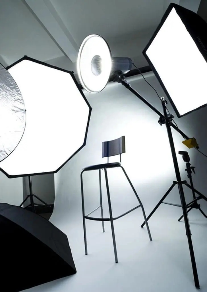 Mobile headshot lighting and backdrop setup in an office